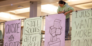 Student hanging poster