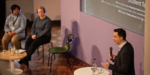 James Ellerby speaking with panel
