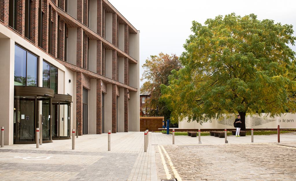 Esther Simpson building in Leeds with a green bushy tree next to it to the right